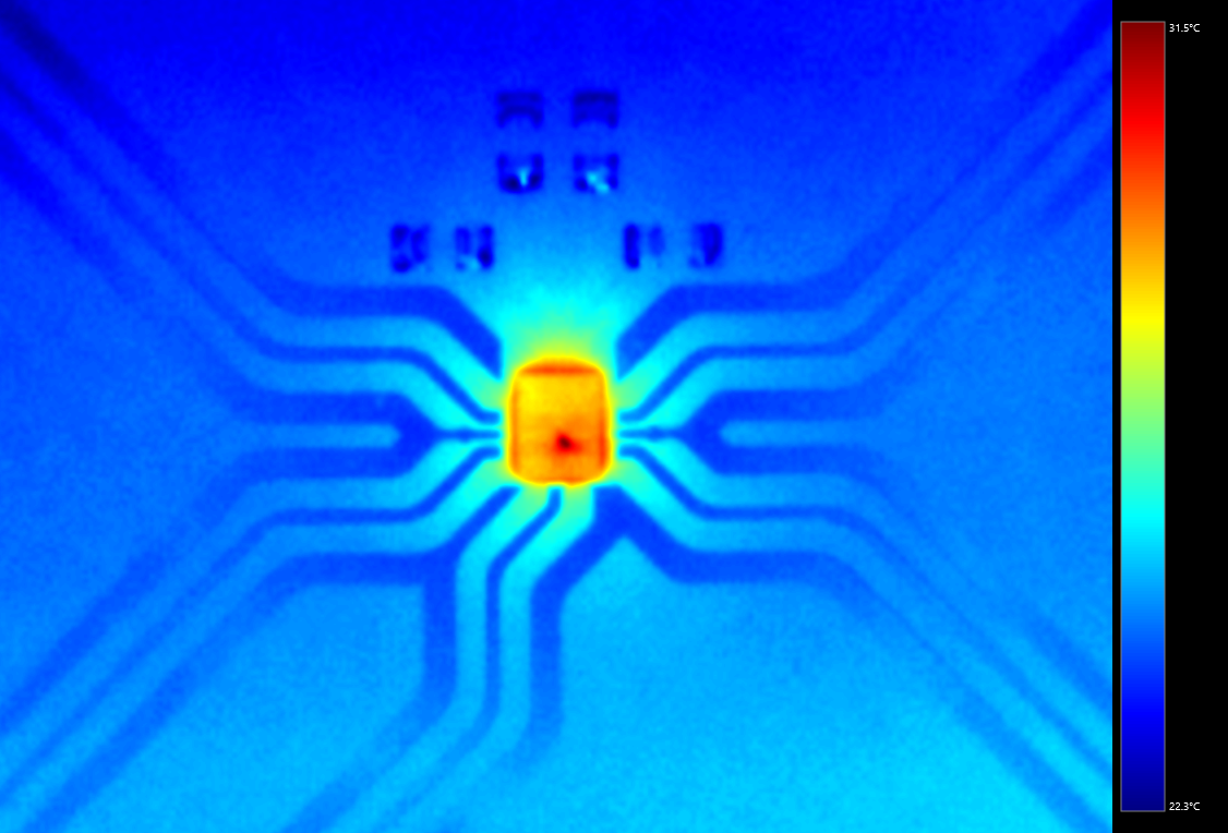 Thermal image of SP4T RF switch showing die hot spot and trace routing through flip-chip package